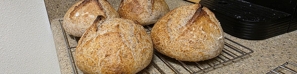 four bread bowls cooling
